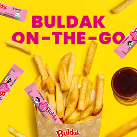 Samyang Buldak Carbonara sauce dipping image highlights quick heat for snacks.