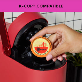 San Francisco Bay OneCup pods in a coffee machine ready for brewing.