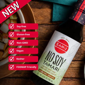 Close-up of San-J No Soy Tamari glass bottle, premium gluten-free flavor.