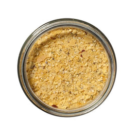 San Juan Island Sea Salt Popcorn Seasoning poured over popcorn showing easy, even flavor distribution.