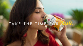 San Pellegrino Aranciata Rossa can showing red-orange hue for gatherings.