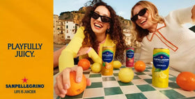 San Pellegrino glass with sparkling drink over ice showing Italian elegance