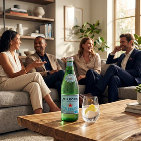 Spa-style table presentation with premium glass bottle and refined setting.