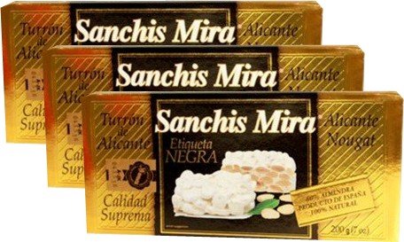 Sanchis Mira Turron de Alicante 7 oz pack on festive table, premium almond nougat gift idea.