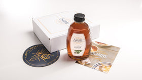 Sandt's Clover Honey jar back view shows label and 2 lb contents, versatile for baking