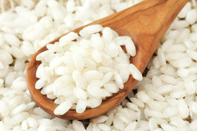 Sanniti Arborio Rice cooking process with gradual stock addition.