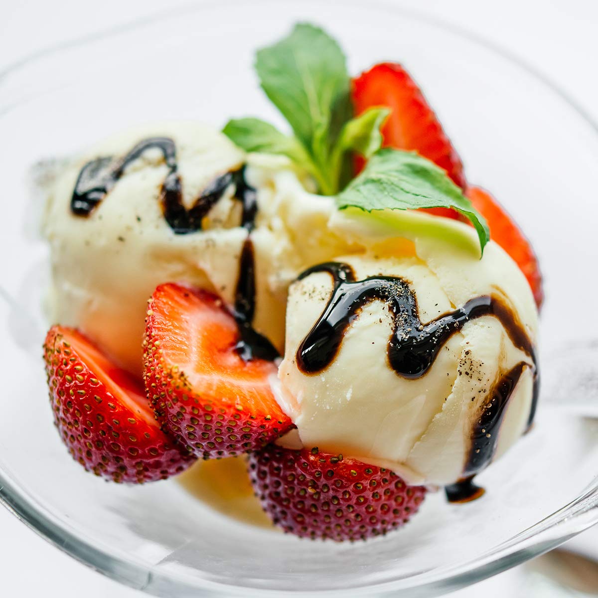 Sanniti balsamic glaze paired with cheese and fruit for a versatile bite.