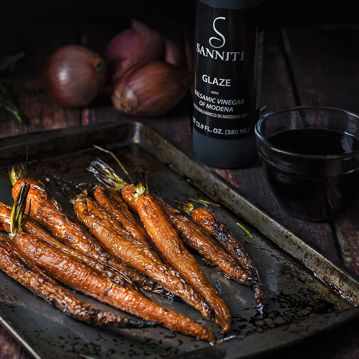 Sanniti balsamic glaze drizzle on salad for a glossy finish.
