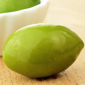 Sanniti Bella di Cerignola olives closeup highlights their large size and buttery, mild flavor.