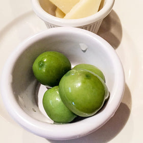 Sanniti Castelvetrano on a cheese board for a tasteful antipasti.