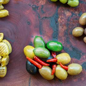 Sanniti Cerignola olives on charcuterie board suggest pairing with cheese and salami.