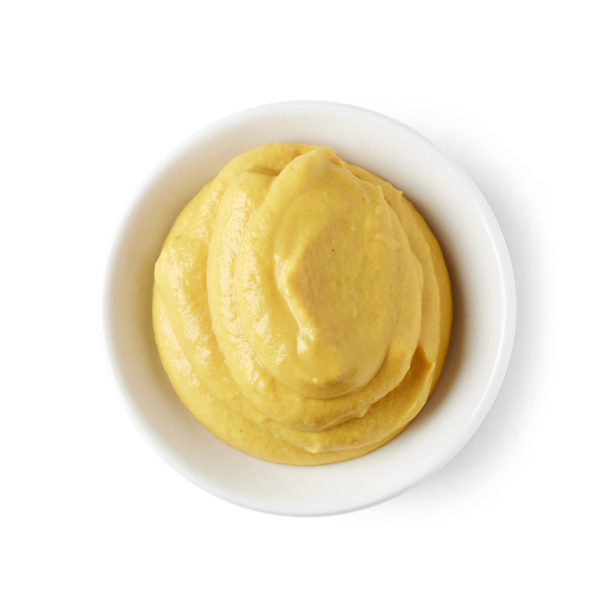 Sanniti Dijon Mustard paired with a sandwich on a plate