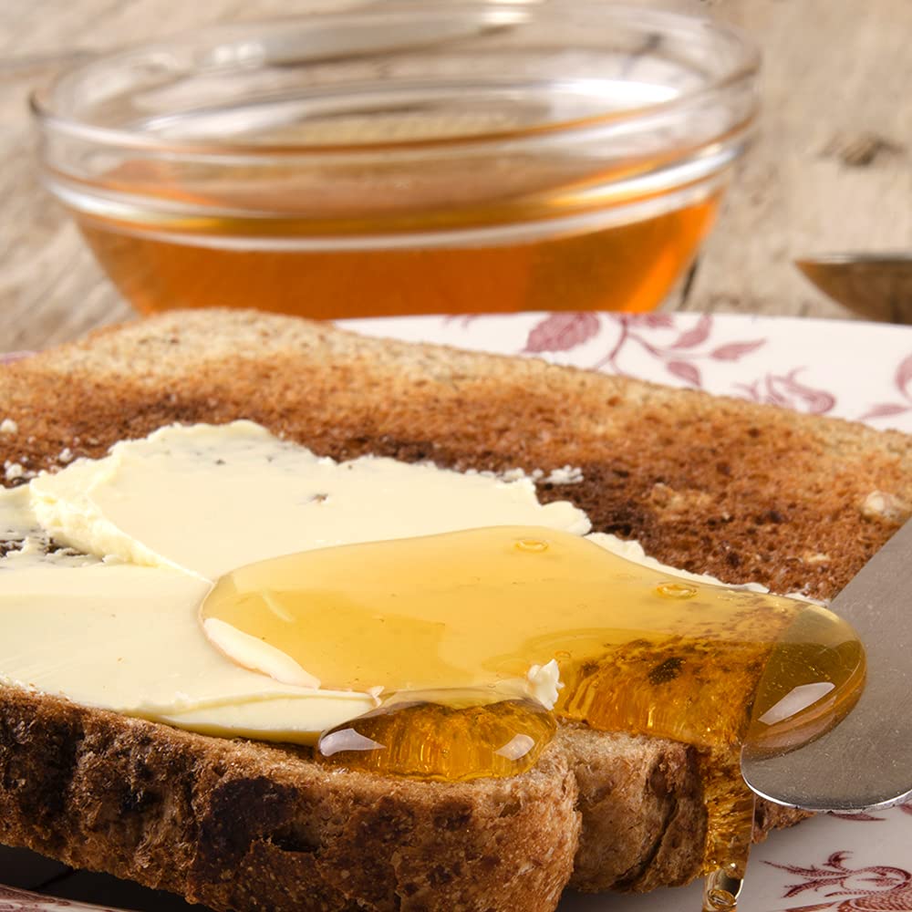 Sanniti Fulmer Acacia honey on a cheese board, pairs with cheeses.
