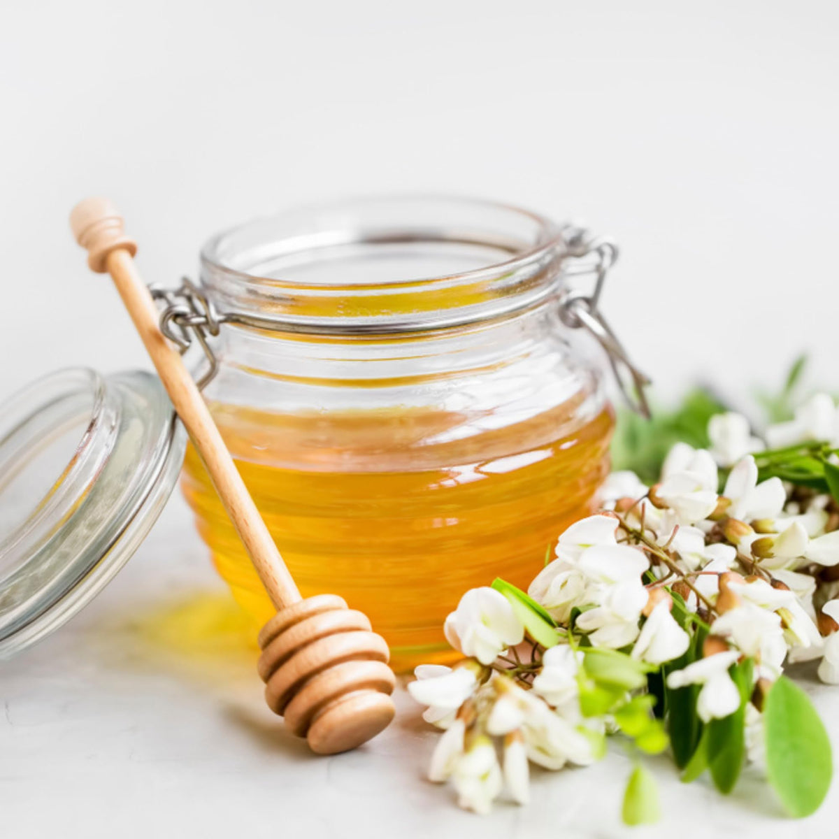 Sanniti Fulmer honey tasting with spoon, highlighting smooth texture.