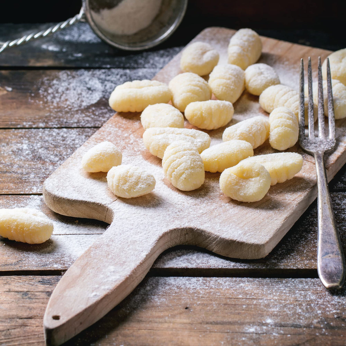 Sanniti gnocchi in creamy pesto offers versatile gluten-free dining options.
