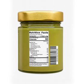 Open jar of Sanniti Marullo Pistachio Spread ready for toppings and tasting.