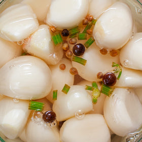 Sanniti pickled garlic as a snack, offering convenient bite-size flavor