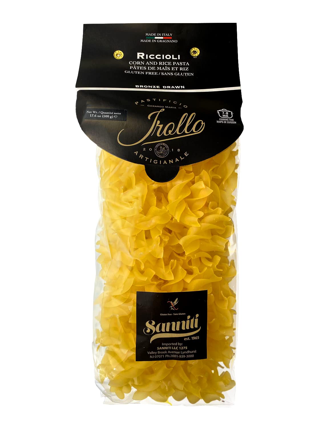 Sanniti Riccioli Pasta Gragnano on a plate with bronze-cut ridges gripping sauce.