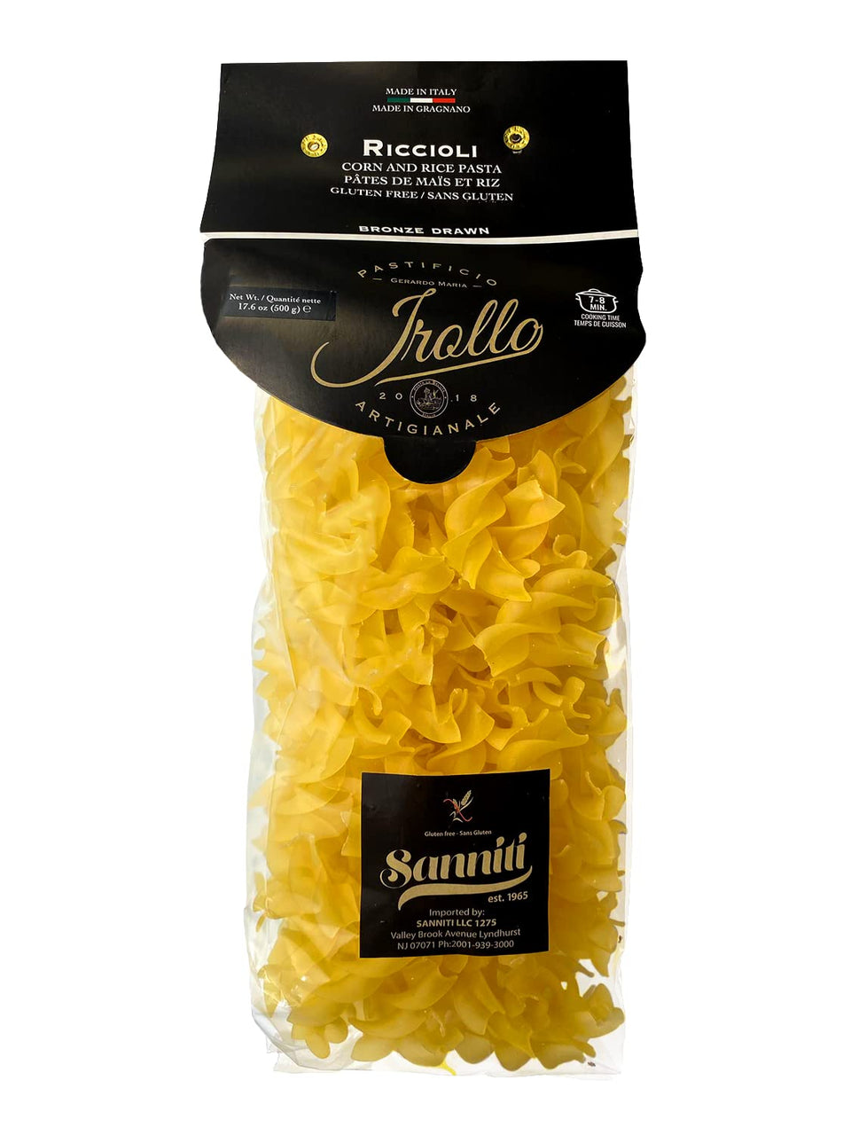 Sanniti Riccioli Pasta Gragnano on a plate with bronze-cut ridges gripping sauce.