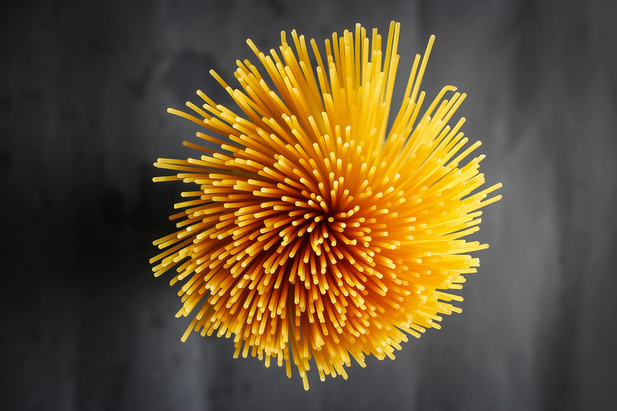 Sanniti spaghetti with tomato sauce on plate, showcasing authentic Italian flavor.