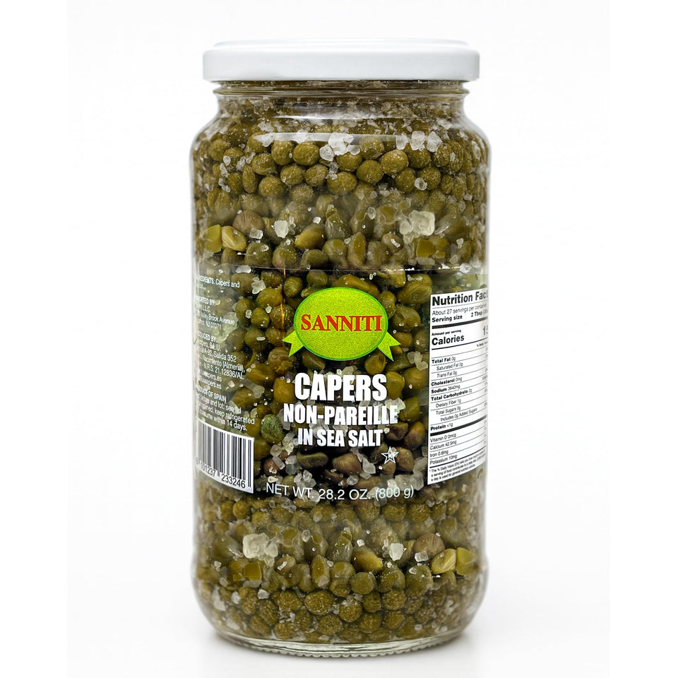 Sanniti Spanish capers nonpareille jar in sea salt, ready to rinse for delicate flavors.