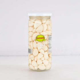 Sanniti Spanish Pickled Garlic open jar with sliced cloves for garnishes