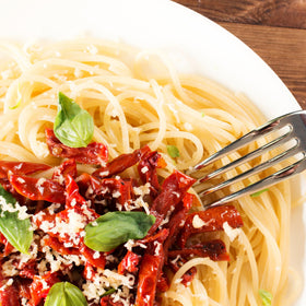 Sanniti sun dried tomatoes in olive oil on pizza topping for savory bites.