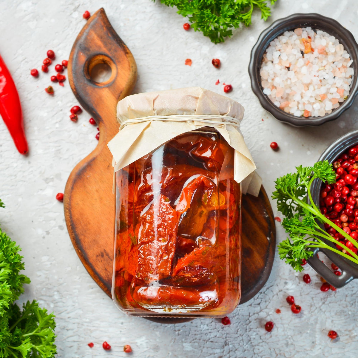 Sanniti sun dried tomatoes in olive oil on sandwich for enhanced flavor.
