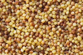 Cooked fregola sarda tossed with vegetables demonstrating versatility.