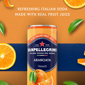 Sanpellegrino Aranciata pours into glass, vibrant orange aroma.