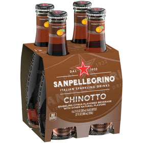 Pouring Chinotto from a bottle into a glass, revealing its sparkling citrus profile.