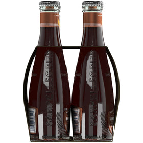 Finely sliced orange peel garnish beside a chilled Chinotto bottle for an elevated finish.