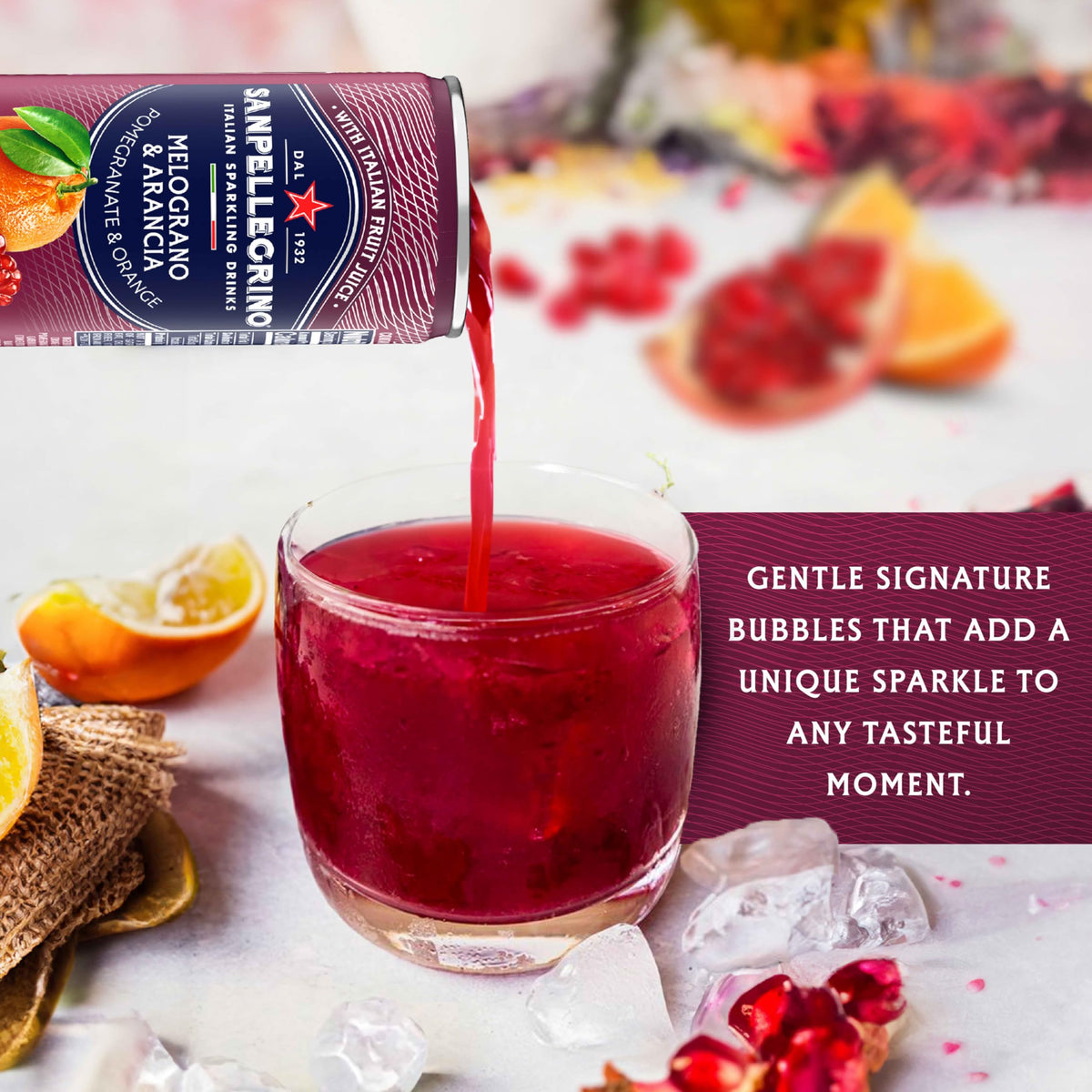 Sanpellegrino Melograno Arancia bottle and orange slice garnish, perfect for entertaining.