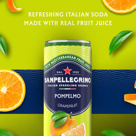 Chilled Sanpellegrino Pompelmo poured into a glass with grapefruit slice, ready to savor.
