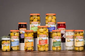 Santa Barbara Olive Co almond-stuffed olives open jar glossy green olives almond center