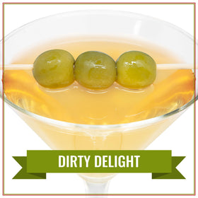 Pouring Dirty Martini Mix from Santa Barbara Olive Co enhances quick, flavorful martinis