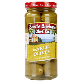 Santa Barbara Olive Co meaty green olive with crunchy garlic detail.