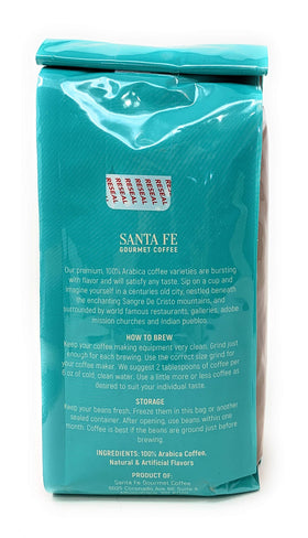 Santa Fe Seasons Pinon Ground coffee cup steaming delivering a cozy, southwest-inspired aroma.