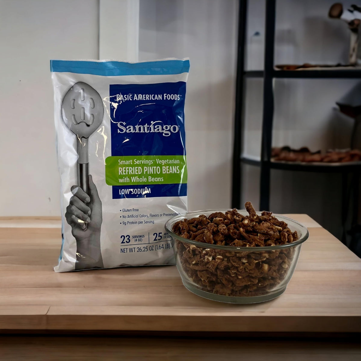 Santiago vegetarian refried beans with whole beans closeup, creamy base for tacos.