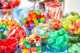 Sarah's Candy Factory jar sits on holiday table.