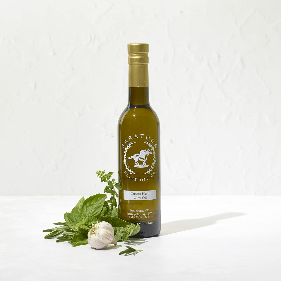 Saratoga Olive Oil Co. Tuscan Herb bottle closeup for vibrant bread dipping.