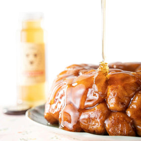 Savannah Bee Company honey with peaches enhances Georgia-inspired desserts.