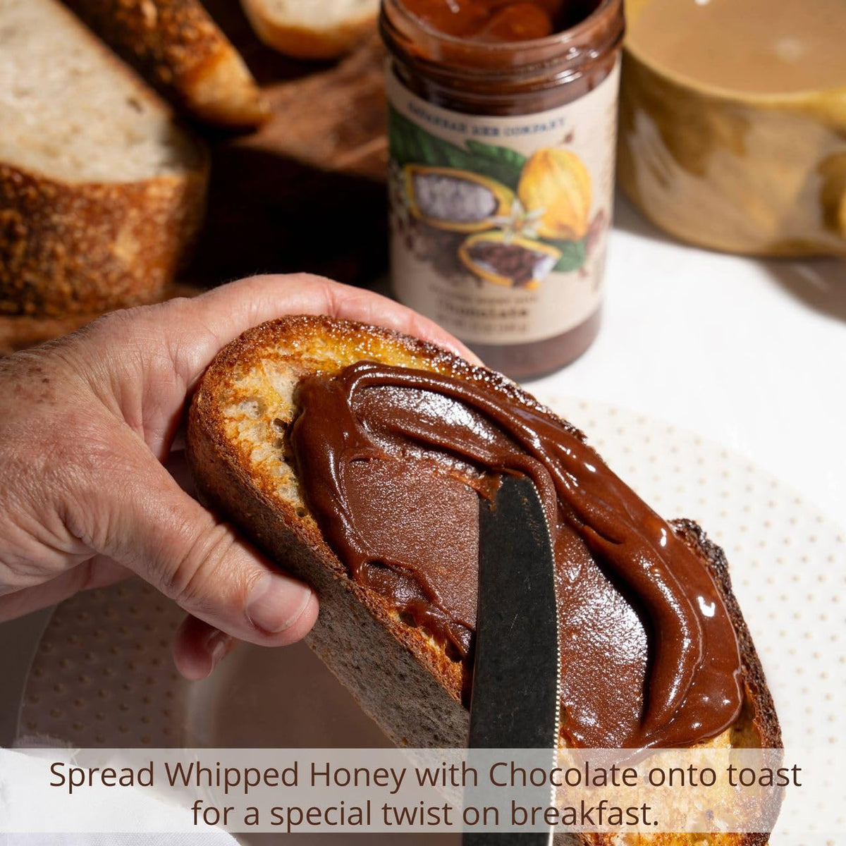 Savannah Bee Company whipped honey chocolate spoon, smooth texture enhances breakfasts.