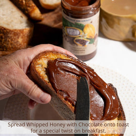Savannah Bee Company whipped honey chocolate spoon, smooth texture enhances breakfasts.