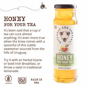 Savannah Bee honey drizzle on a spoon, highlighting floral notes.