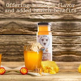 Savannah Bee honey jar with spoon ready to sweeten brews.