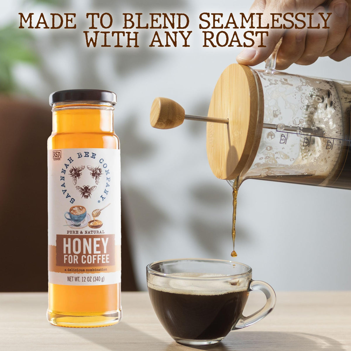 Savannah Bee honey beside latte art in a cup.