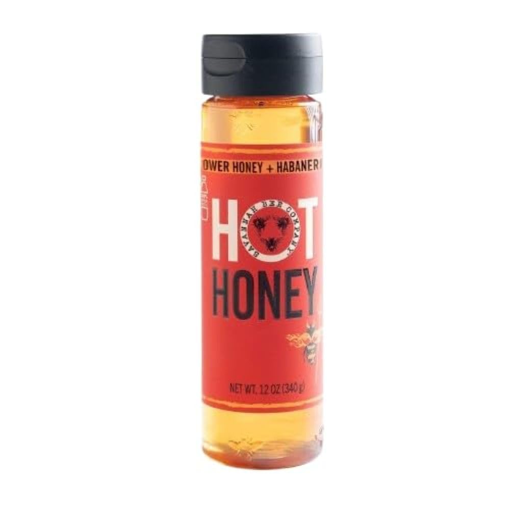Savannah Bee hot honey bottle close-up reveals wildflower and habanero infusion for bold flavor.