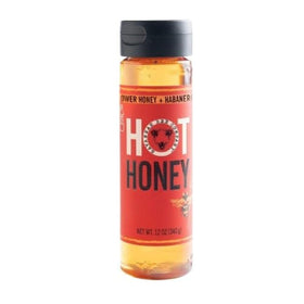 Savannah Bee hot honey bottle close-up reveals wildflower and habanero infusion for bold flavor.