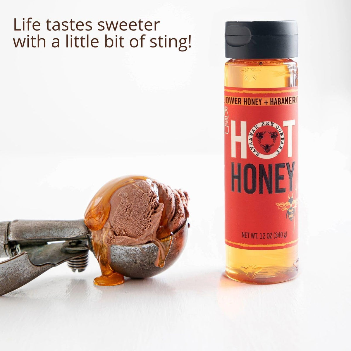 Savannah Bee hot honey in a glass with tea, suggesting warming aroma.
